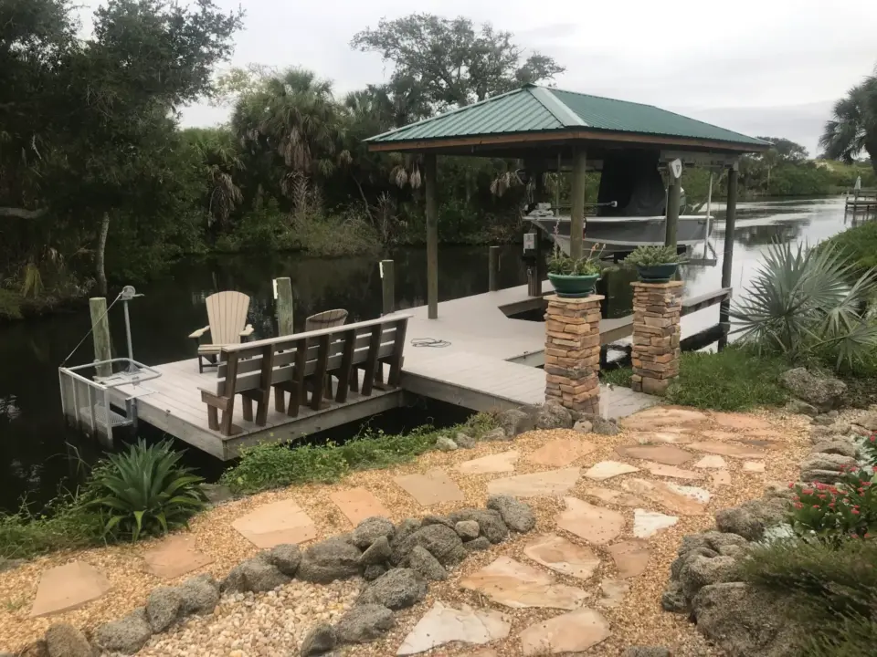 Deck with boathouse construction and outdoor furniture
