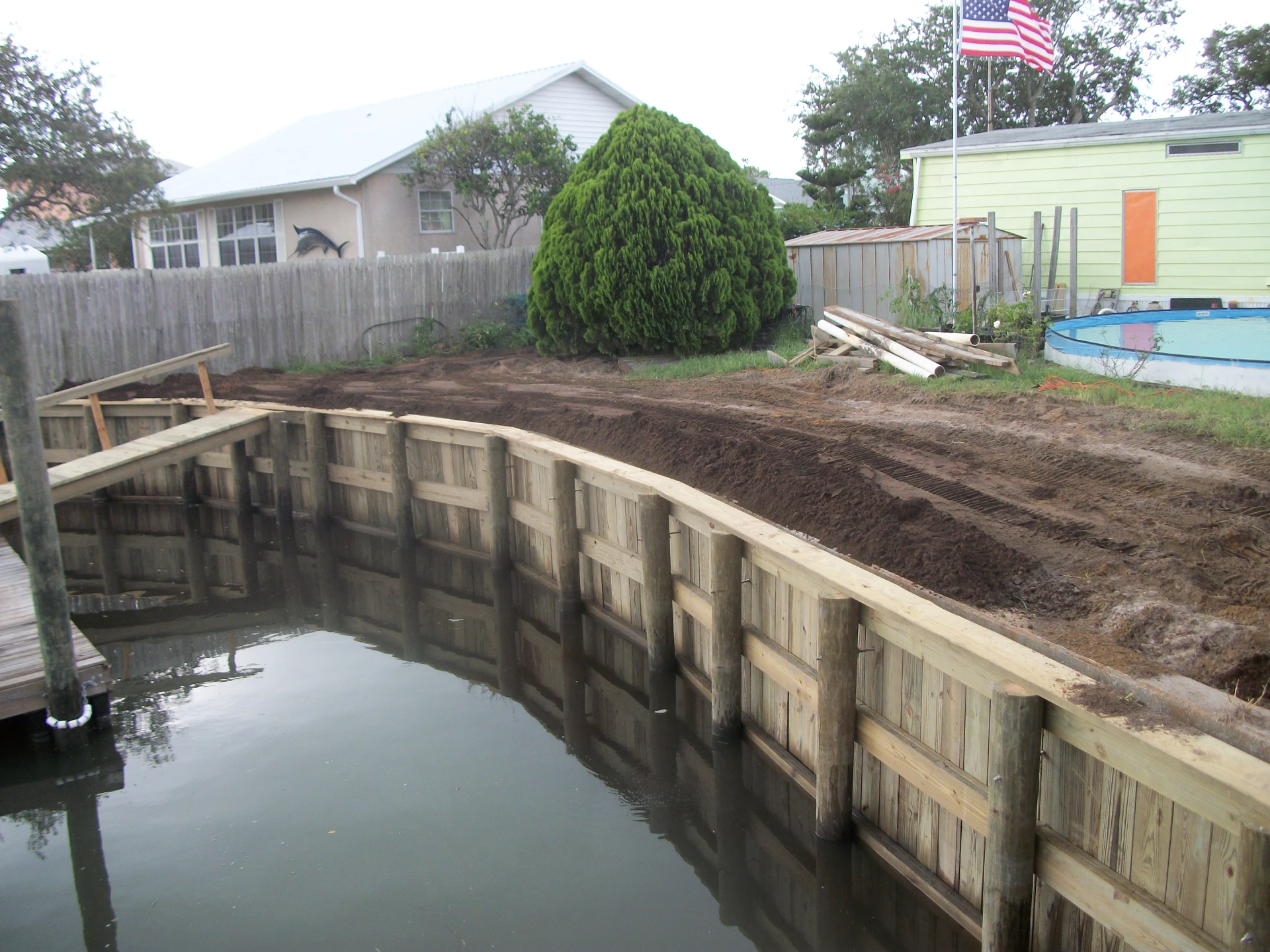 Seawall construction with bulkhead repairs on the florida