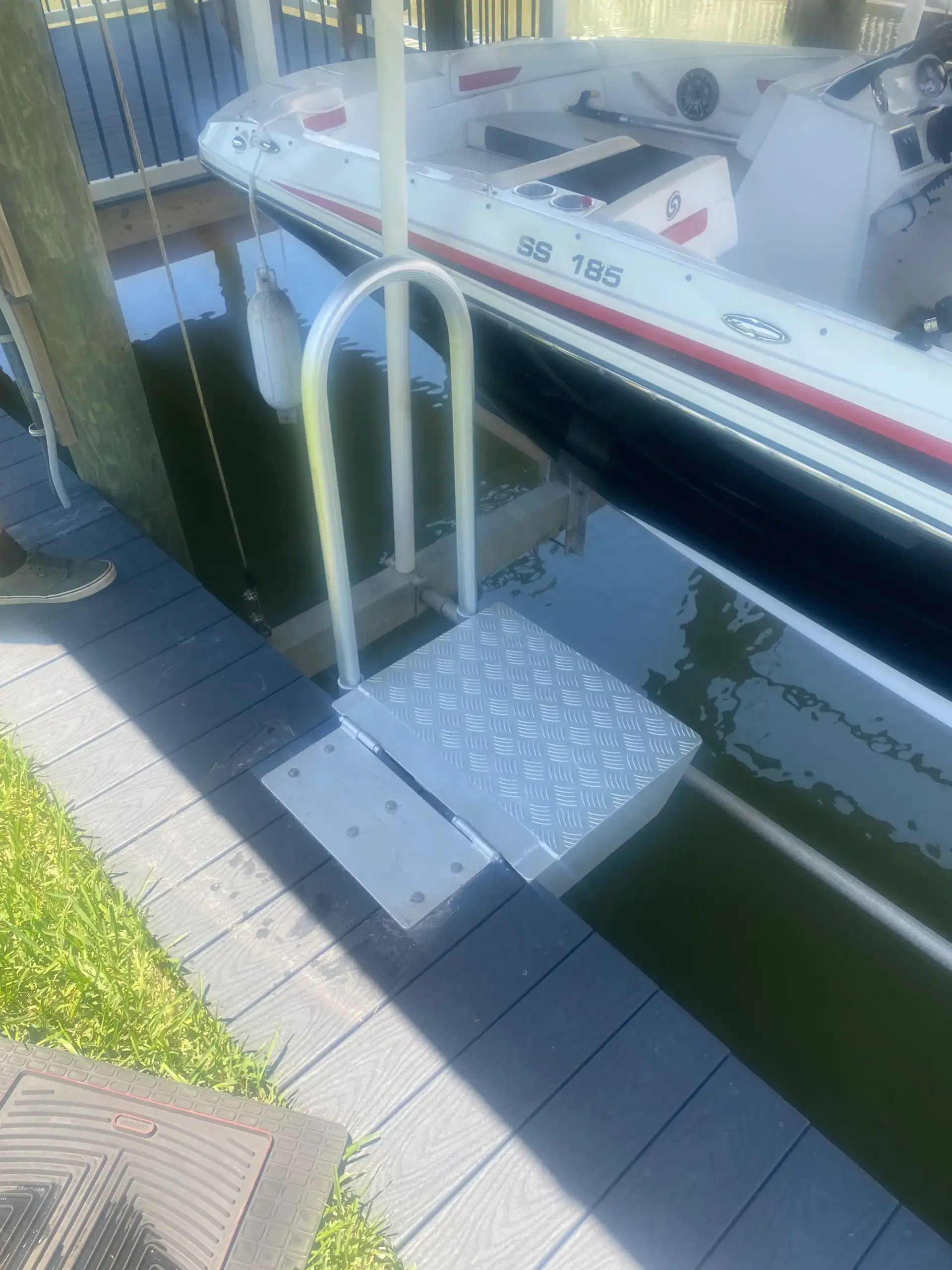 Wood deck with boat lifts on the florida